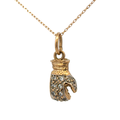 9ct yellow gold boxing glove pendant weighing 5g, Reeves and Sons jewelry, detailed close-up of the pendant on a plain background.
