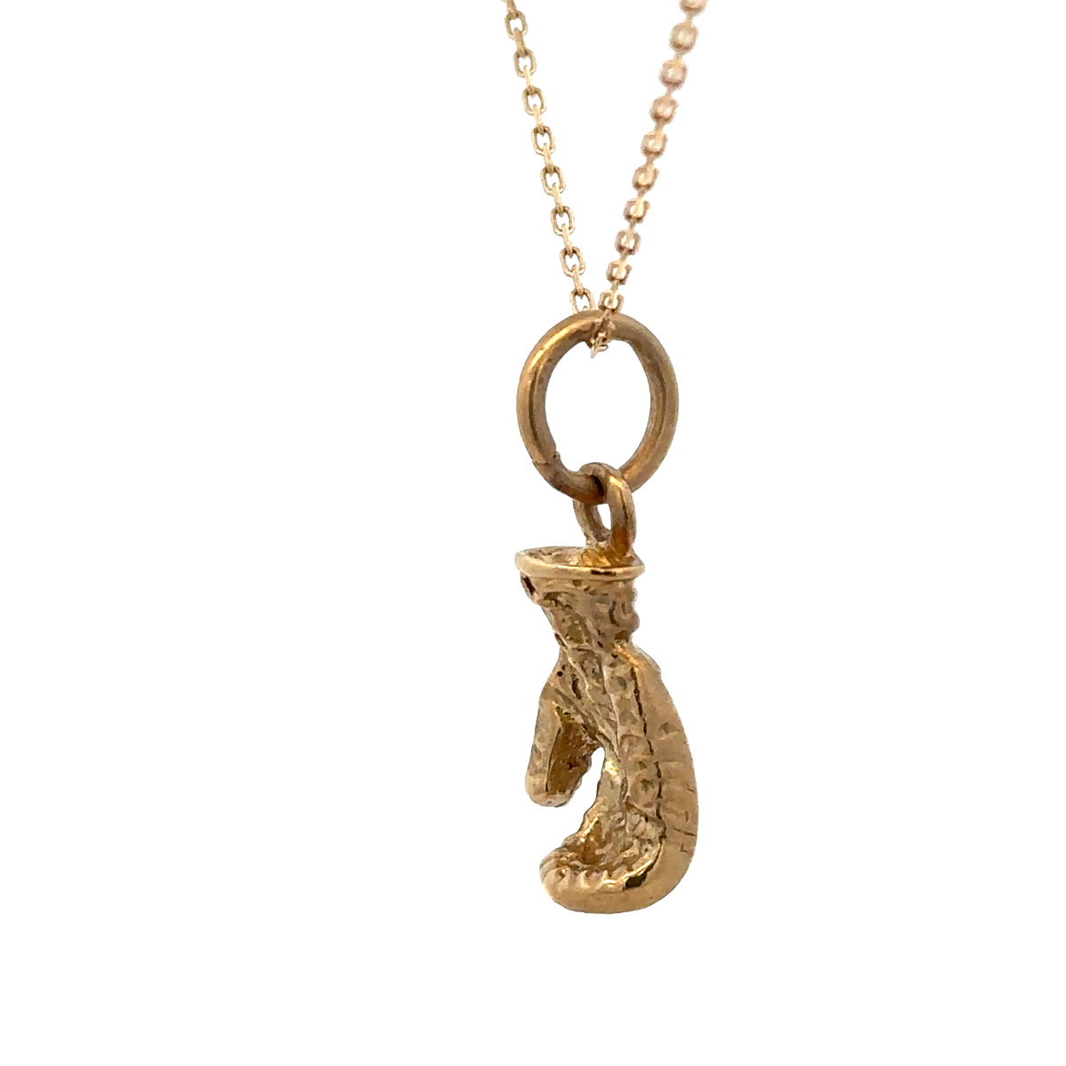9ct yellow gold boxing glove pendant by Reeves and Sons, 5g, showing detailed boxing glove design on a plain background.