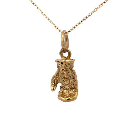 9ct yellow gold boxing glove pendant, Reeves and Sons, 5g, detailed jewelry pendant with textured boxing glove design.