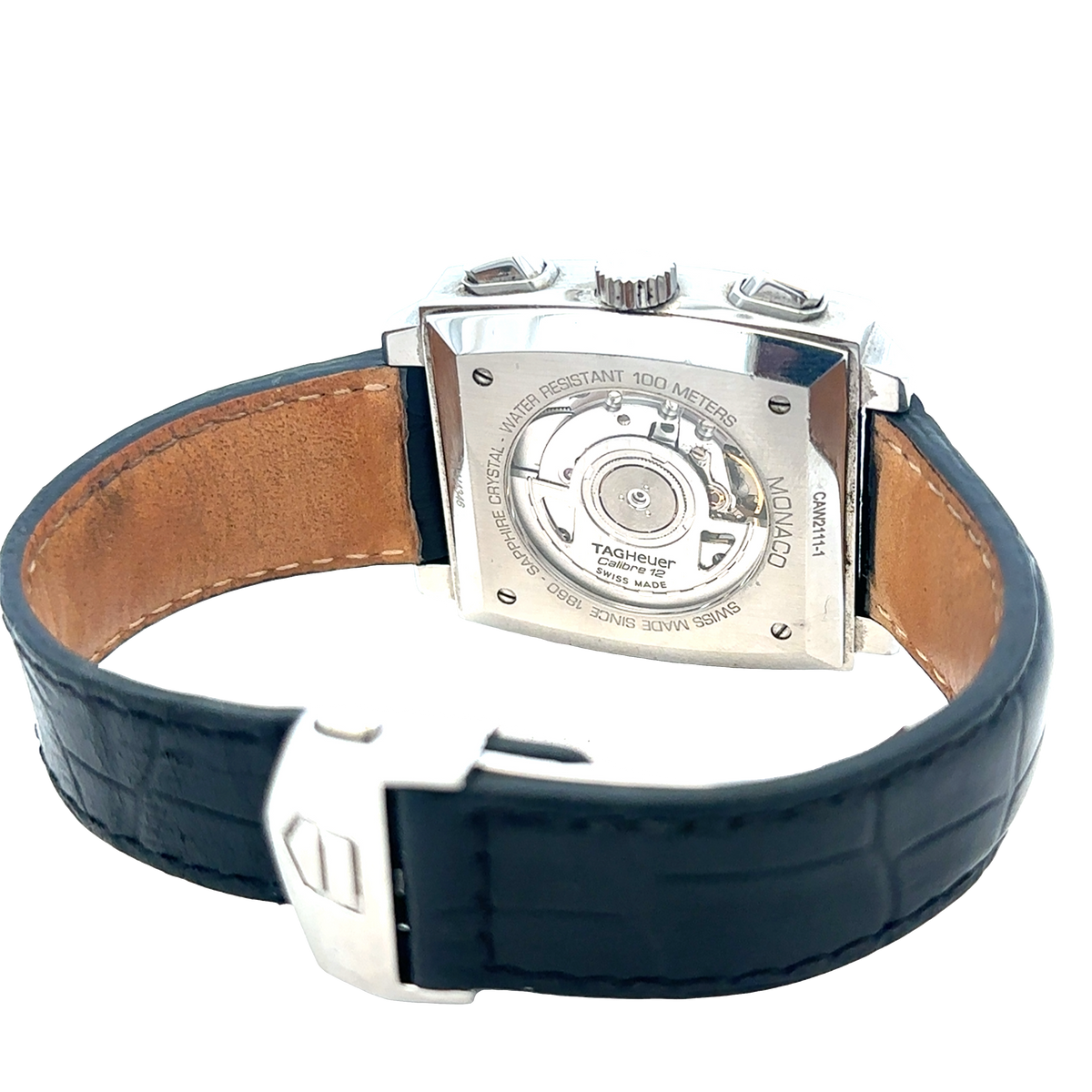 Reeves and Sons Tag Heuer Monaco automatic chronograph watch with black dial and stainless steel bracelet.