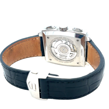Reeves and Sons Tag Heuer Monaco automatic chronograph watch with black dial and stainless steel bracelet.