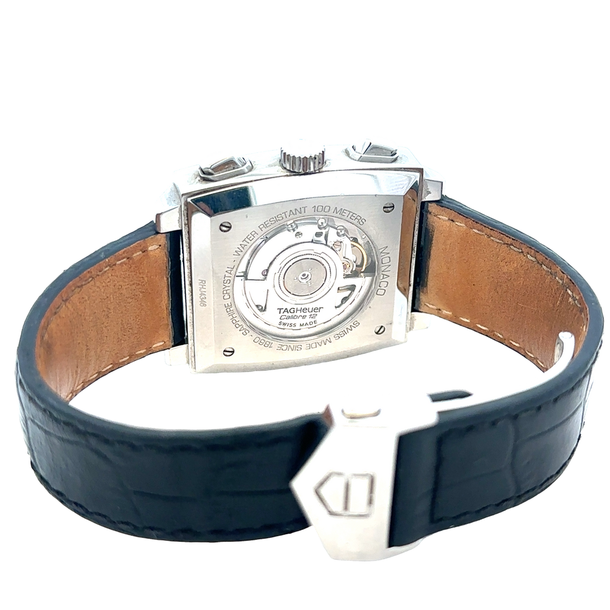 Tag Heuer Monaco automatic chronograph watch with silver dial and black leather strap, showcasing the luxury timepiece.