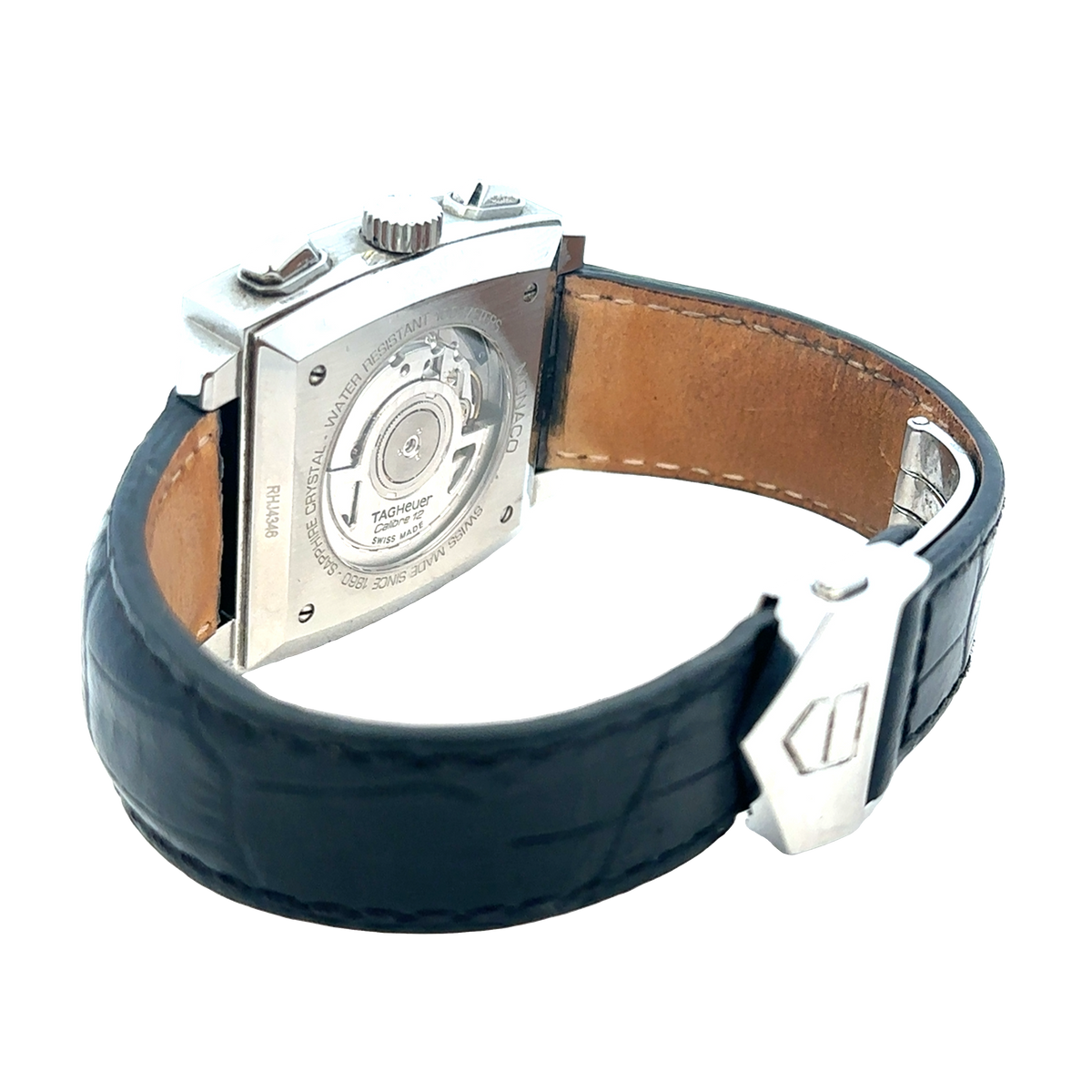 Tag Heuer Monaco automatic chronograph watch with black dial and stainless steel case, displayed on a white background.
