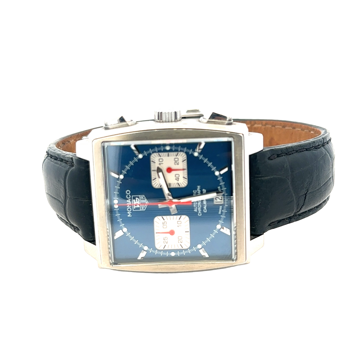 Reeve and Sons Tag Heuer Monaco automatic chronograph watch with black dial, silver case, and leather strap.