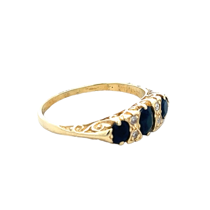 18ct sapphire and diamond ring by Reeves and Sons, size M, featuring a central sapphire surrounded by sparkling diamonds.
