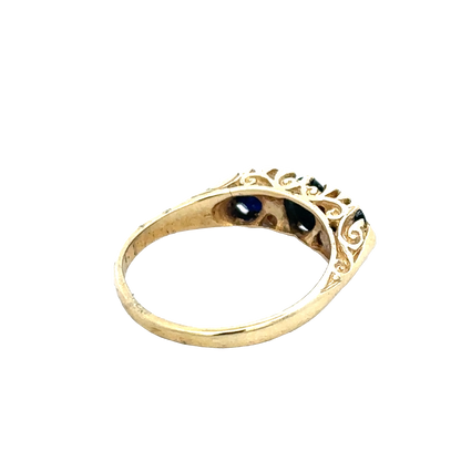 18ct sapphire and diamond ring by Reeves and Sons, size M, featuring a central sapphire gemstone surrounded by diamonds.