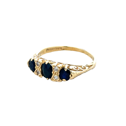 18ct sapphire and diamond ring by Reeves and Sons, size M, featuring a central sapphire surrounded by sparkling diamonds.
