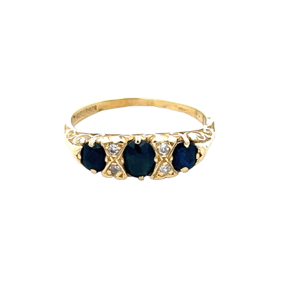 18ct sapphire and diamond ring in size M by Reeves and Sons, featuring a central sapphire gemstone with surrounding diamonds.