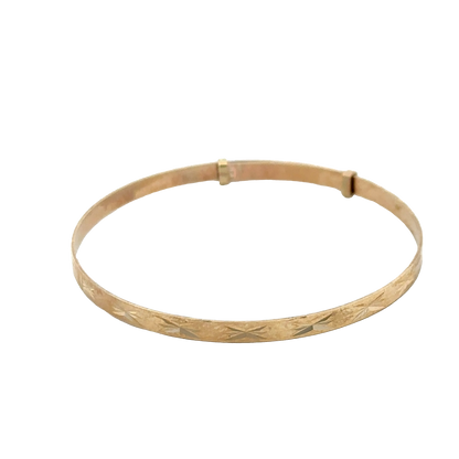 9ct yellow gold baby bangle weighing 1.8g with a smooth, polished finish, featuring a delicate design from Reeves and Sons.