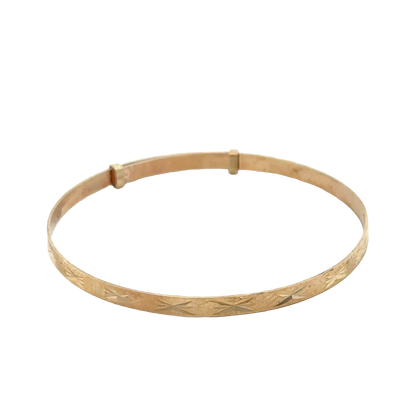 9ct yellow gold baby bangle with a delicate design, weighing 1.8g, made by Reeves and Sons.
