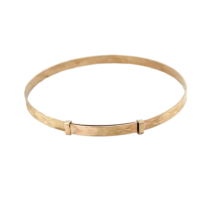 9ct yellow gold baby bangle from Reeves and Sons, delicate jewelry piece weighing 1.8g, designed for infants or young children.
