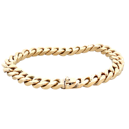 9ct yellow gold curb bracelet by Reeves and Sons, 53.4g, featuring interlocking polished links