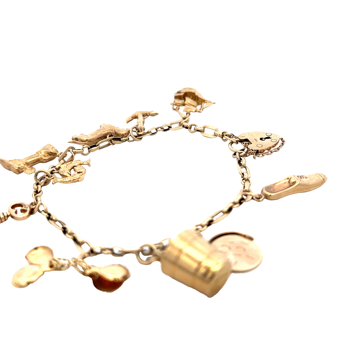 9ct yellow gold charm bracelet by Reeves and Sons, 16.3g, featuring multiple dangling charms