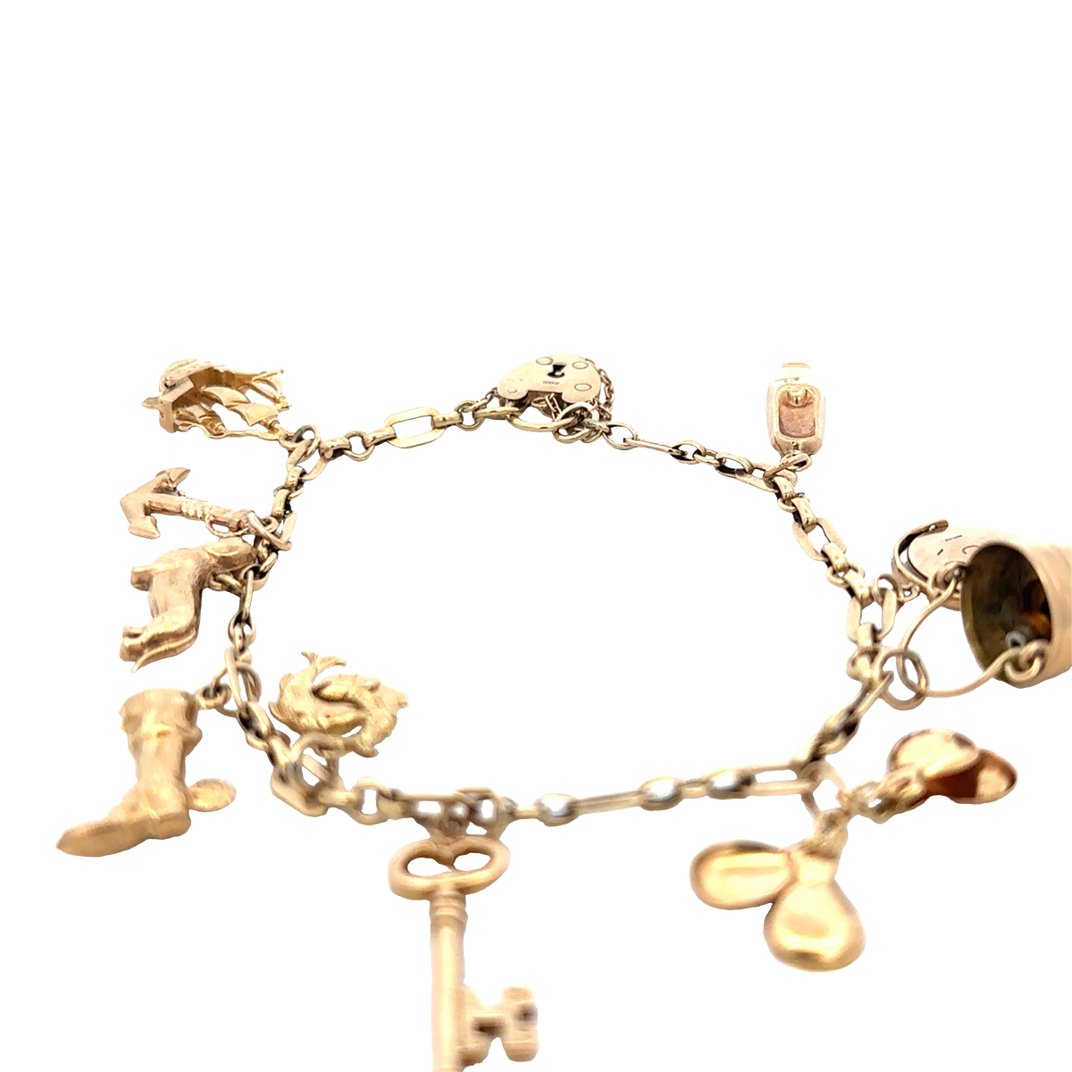 9ct yellow gold charm bracelet by Reeves and Sons, 16.3g, featuring multiple hanging charms