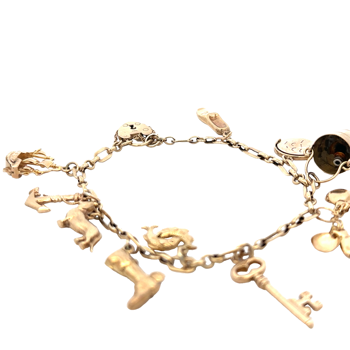 9ct yellow gold charm bracelet by Reeves and Sons, 16.3g, featuring multiple dangling charms