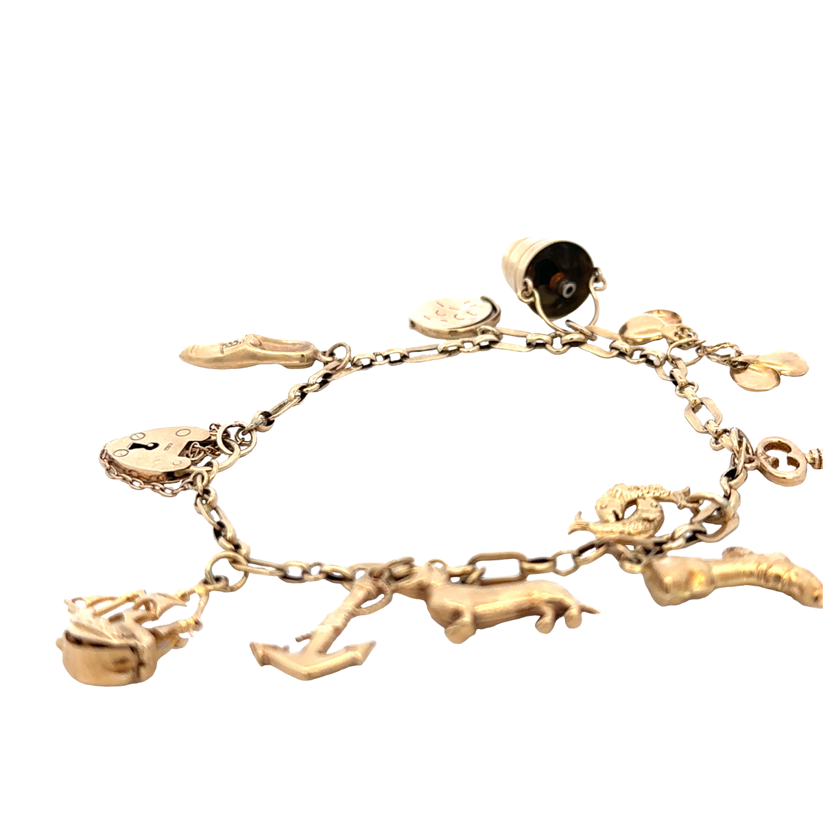 9ct yellow gold charm bracelet by Reeves and Sons, 16.3g weight, featuring assorted charms