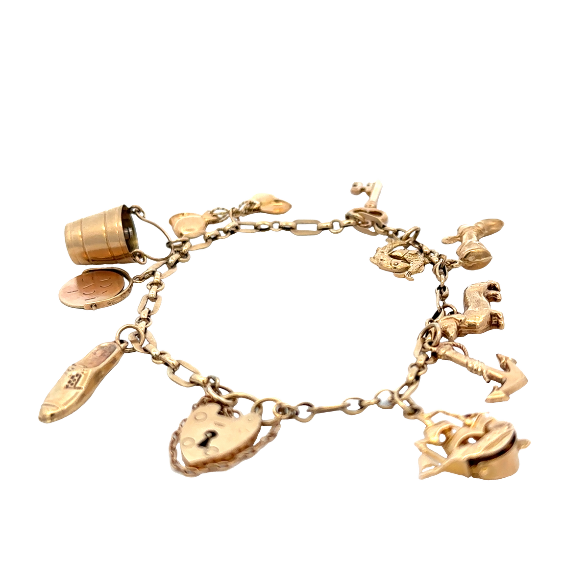 9ct yellow gold charm bracelet by Reeves and Sons, 16.3g, featuring multiple dangling charms