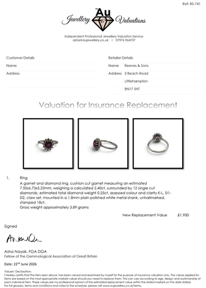 18ct white gold garnet and diamond ring by Reeves and Sons, featuring a central garnet stone surrounded by sparkling diamonds.