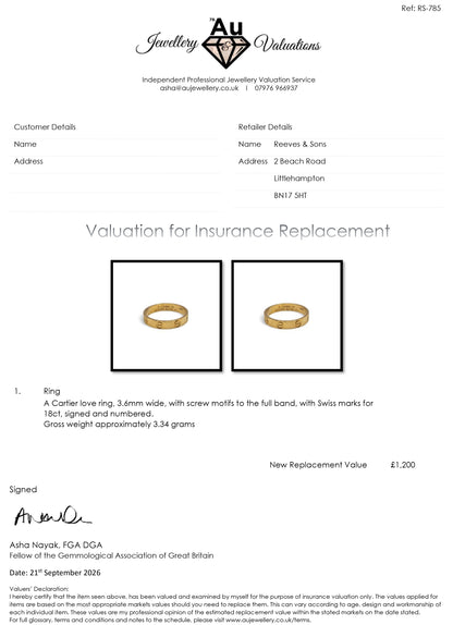18ct yellow gold Cartier Love ring with engraved design, shown on a white background, by Reeves and Sons.