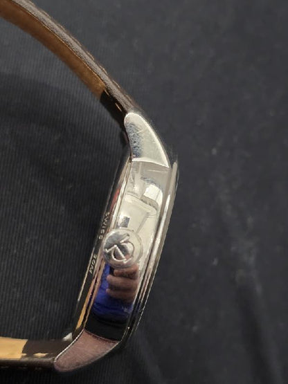 Baume & Mercier GMT automatic dual time power reserve watch with black dial and stainless steel case.