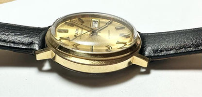 Bulova plated automatic watch with stainless steel case, featuring a sleek design and a 44.9g weight.