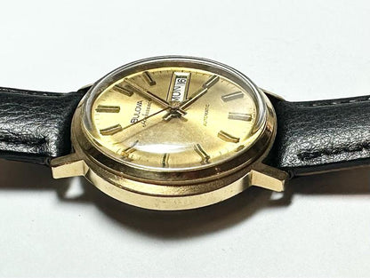 Bulova plated automatic watch with a sleek design, weighing 44.9g, featuring a polished finish and classic timepiece details.