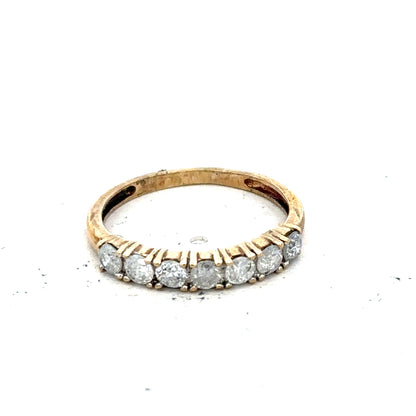 9ct half-carat diamond eternity ring by Carat featuring a continuous row of sparkling diamonds in a sleek band.