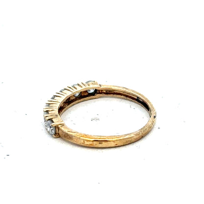9ct gold diamond eternity ring with half-carat total weight, featuring a continuous row of sparkling diamonds by Carat.