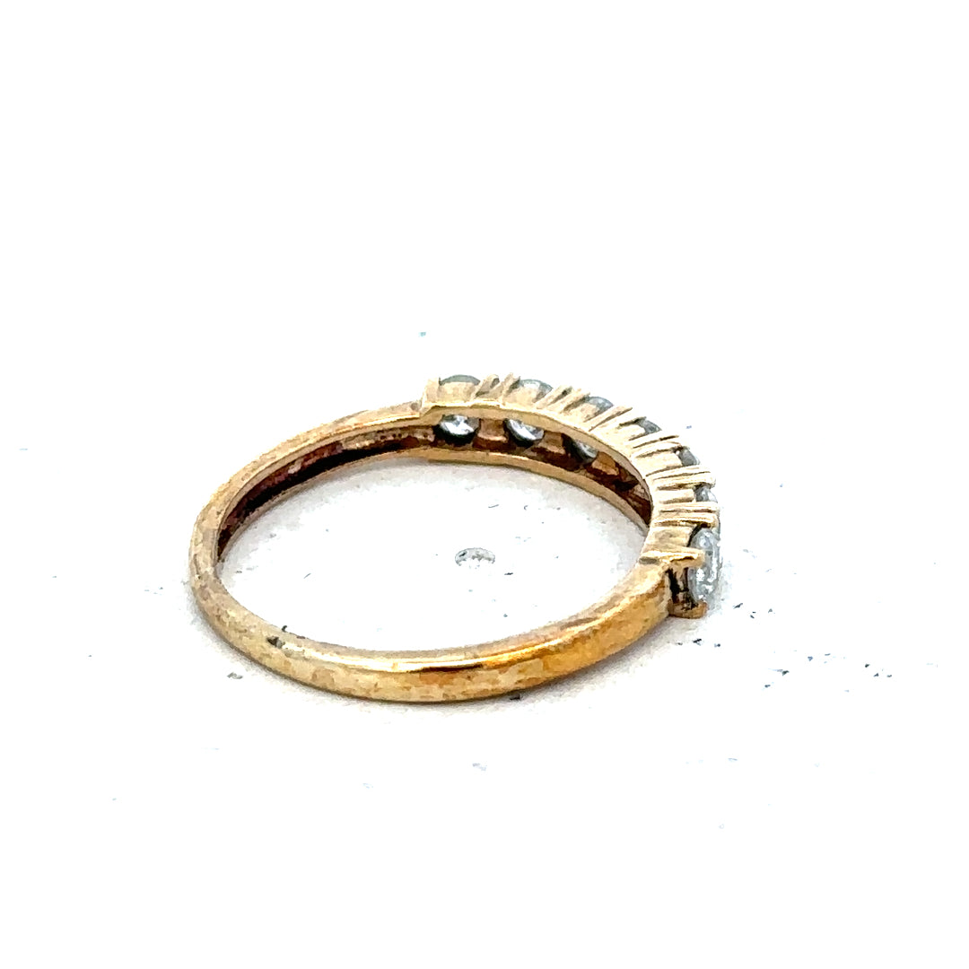 9ct half-carat diamond eternity ring by Carat featuring a continuous row of sparkling diamonds on a sleek band.