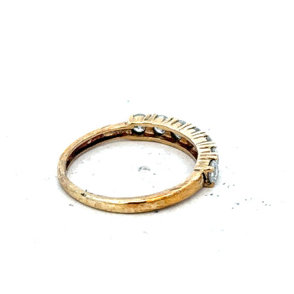 9ct half-carat diamond eternity ring by Carat featuring a continuous row of sparkling diamonds on a sleek band.