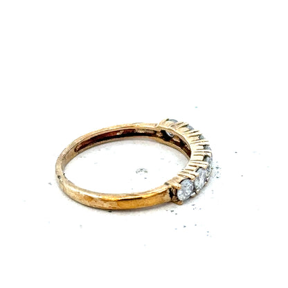 9ct gold diamond eternity ring by Carat featuring half-carat round cut diamonds in a continuous band.
