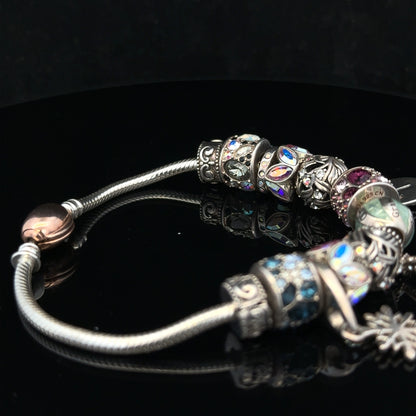 925 silver Chamilia charm bracelet with intricate charms and clasp, designed for customizable jewelry collection.