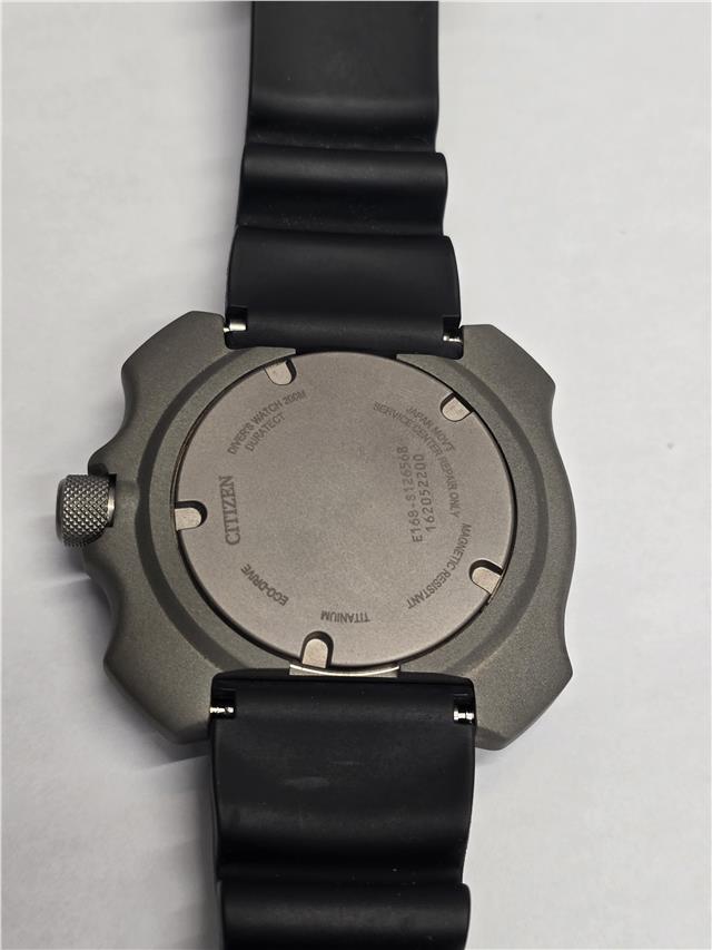 Citizen Eco-Drive titanium diver's watch with black dial, stainless steel strap, and rotating bezel for underwater use.