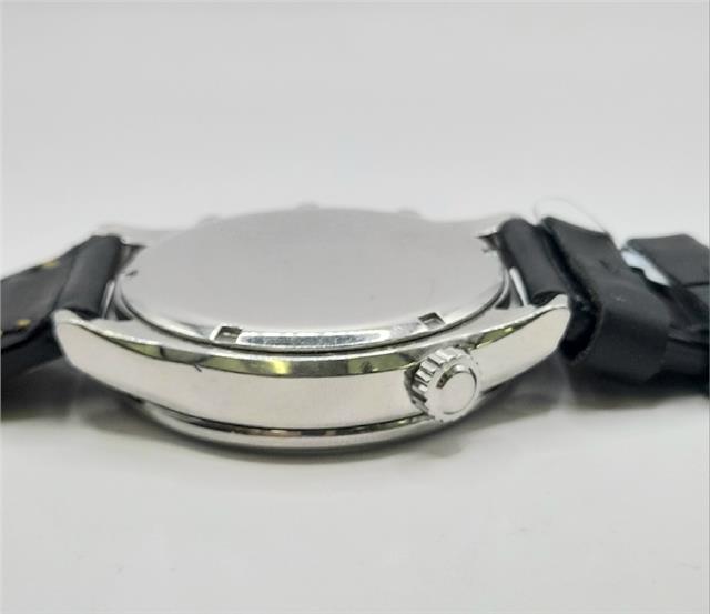 Citizen WR100 Eco-Drive watch SH24922B with stainless steel band, black dial, and date display.