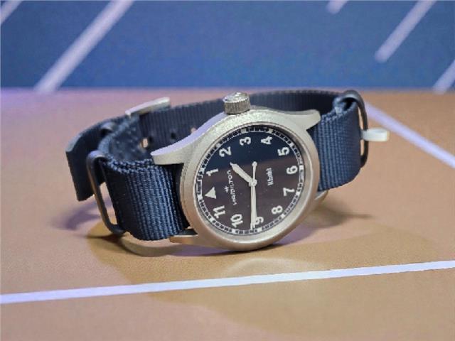 Hamilton Khaki Watch Age 2025 with black dial, stainless steel case, and leather strap, showcasing a classic military-inspired design.