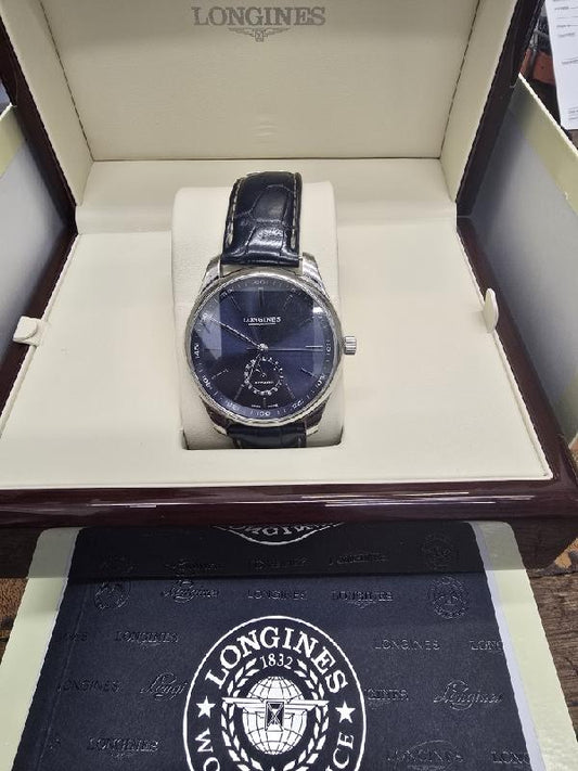Longines Master Collection watch with boxed papers, featuring a stainless steel case and classic dial design.