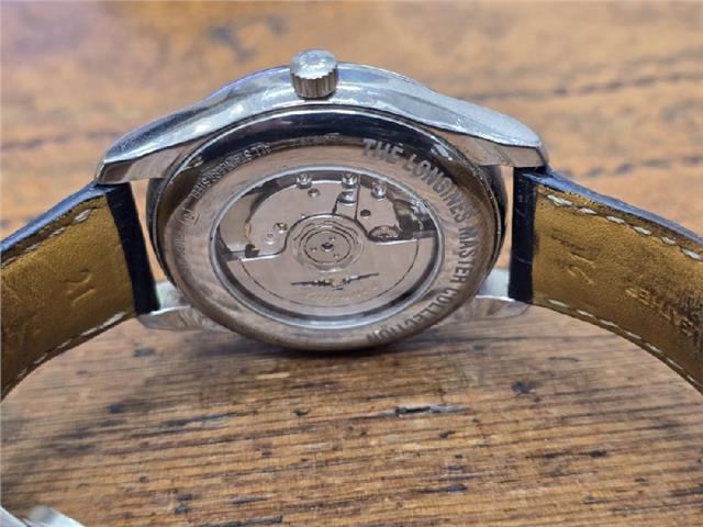 Longines Master Collection watch with boxed papers, featuring a sleek design, stainless steel case, and elegant dial.