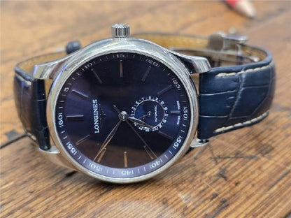 Longines Master Collection watch with boxed papers, featuring a sleek silver dial and stainless steel bracelet.