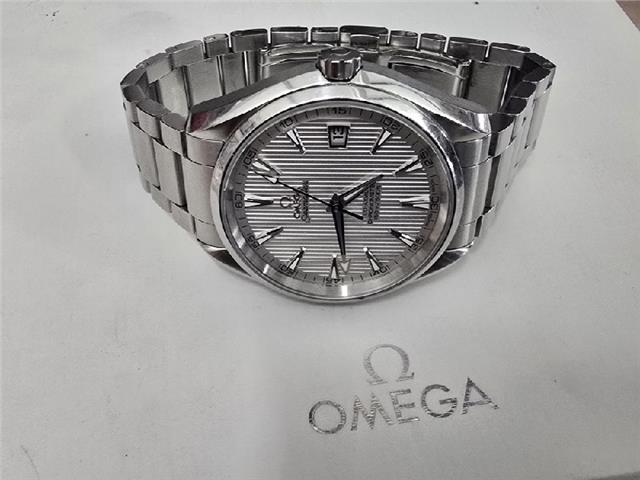 Omega Seamaster Aqua Terra Co-Axial watch with full set, featuring a stainless steel case, blue dial, and bracelet.