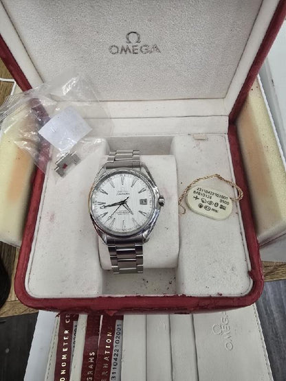 Omega Seamaster Aqua Terra Co-Axial watch full set with stainless steel bracelet, blue dial, and date display.