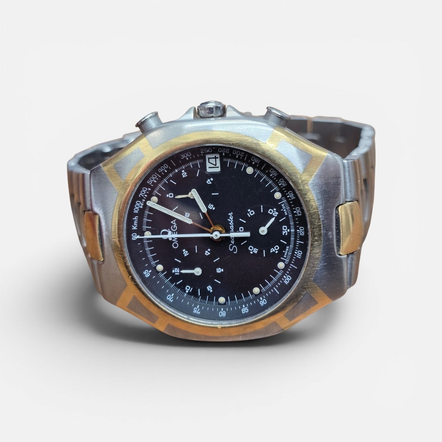 Omega Seamaster Polaris Chronograph watch with box and card, featuring a stainless steel case and black dial.