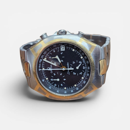Omega Seamaster Polaris Chronograph watch with box and card, featuring a stainless steel case and black dial.
