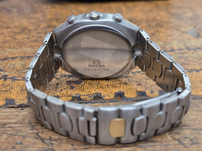 Omega Seamaster Polaris Chronograph watch with boxed packaging and authenticity card, featuring a sleek stainless steel design.