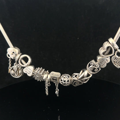 Pandora 20-inch charm necklace with silver chain and decorative charms, stylish jewelry accessory.