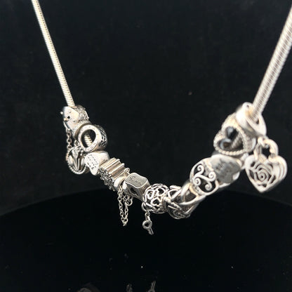 Pandora 20-inch charm necklace with silver chain and decorative charms, stylish jewelry accessory.