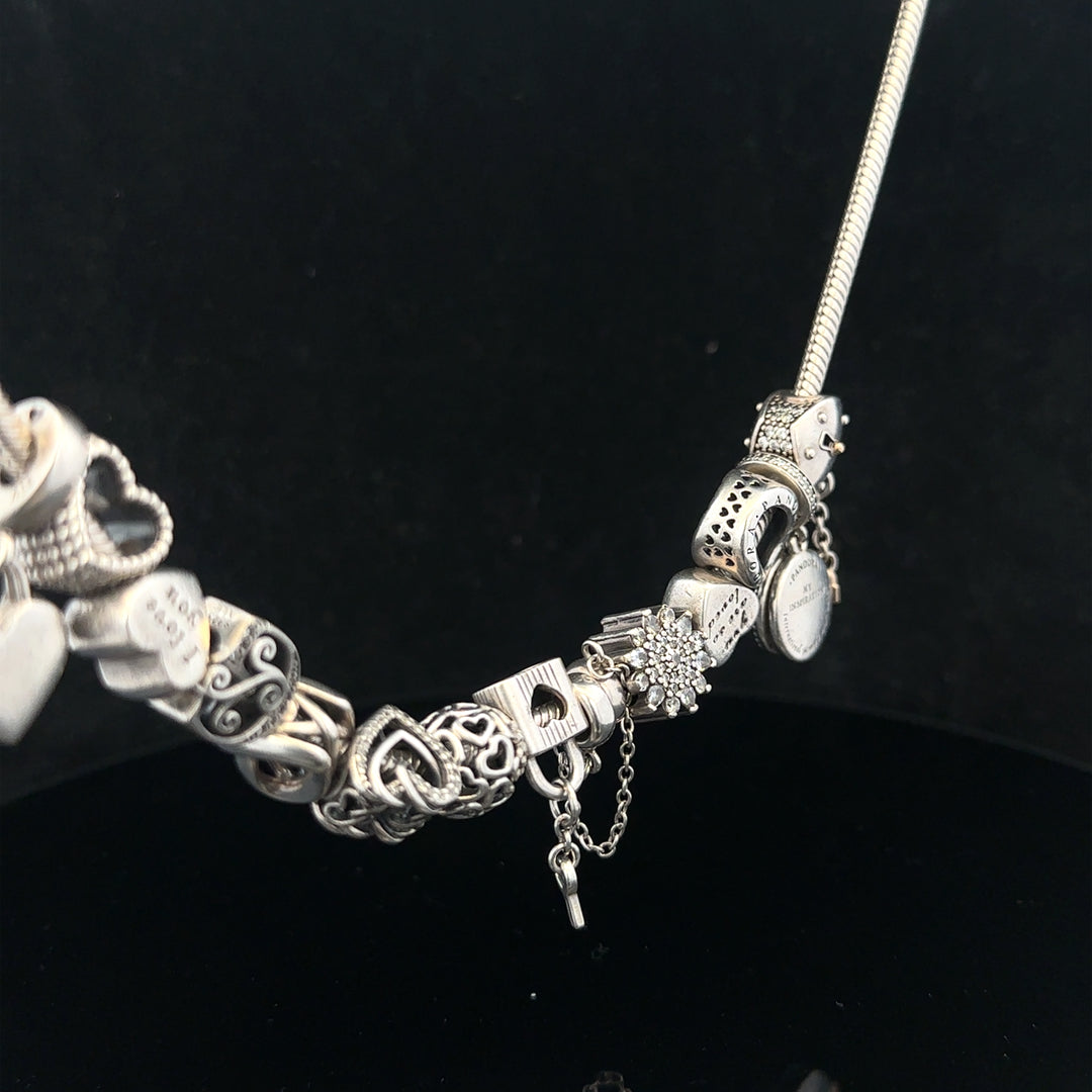PANDORA charm necklace, 20-inch silver chain with decorative charms, stylish jewelry accessory.