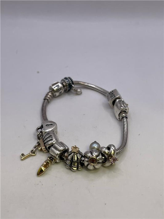 Silver Pandora bracelet featuring a sleek design, weighing 42.3 grams, with a shiny finish and intricate details.