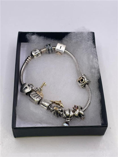 Silver Pandora bracelet with intricate chain design, weighing 42.3 grams, featuring detailed craftsmanship and polished finish.