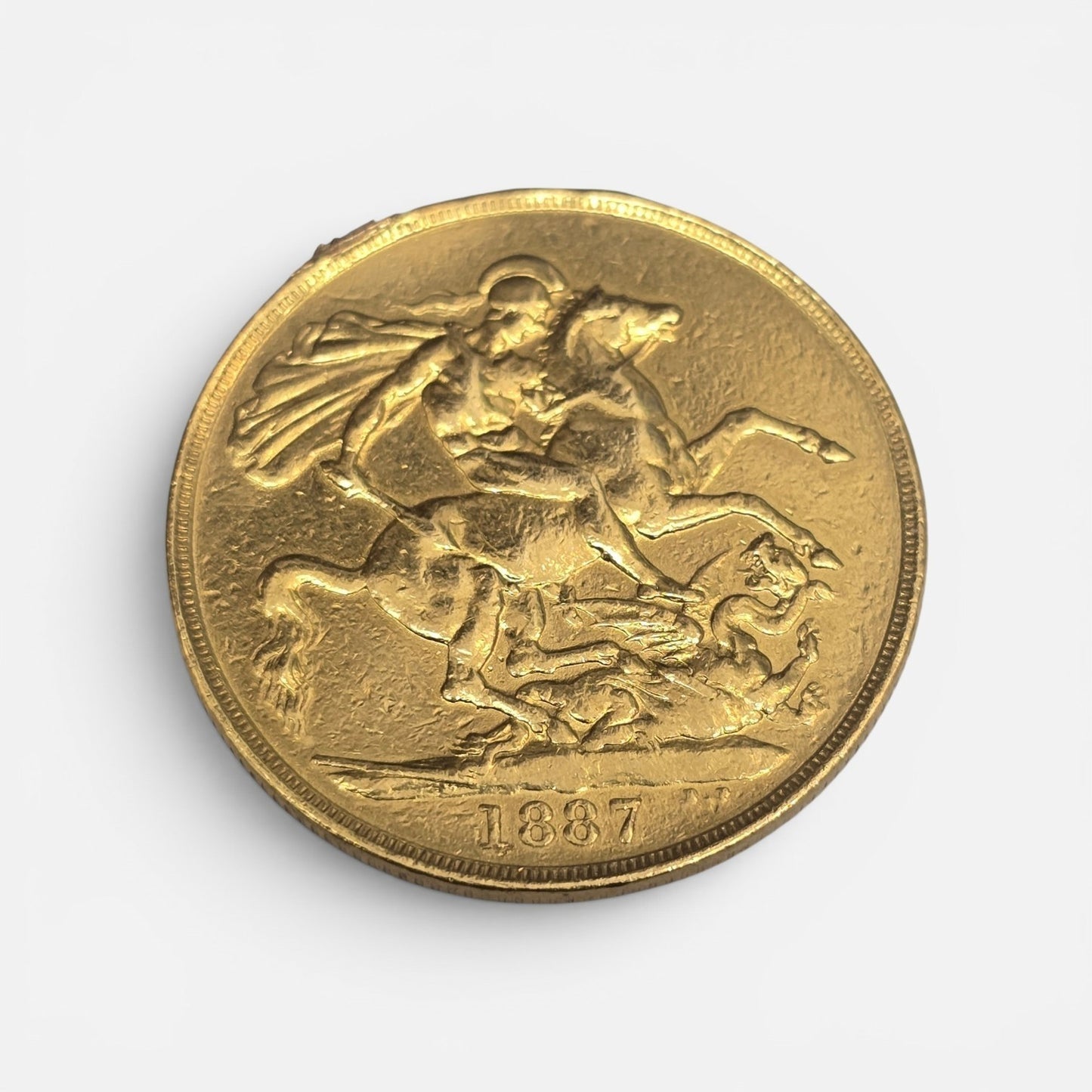 1887 Double Sovereign coin by Reeves and Sons, showing detailed side with intricate design and historical gold coin appearance.