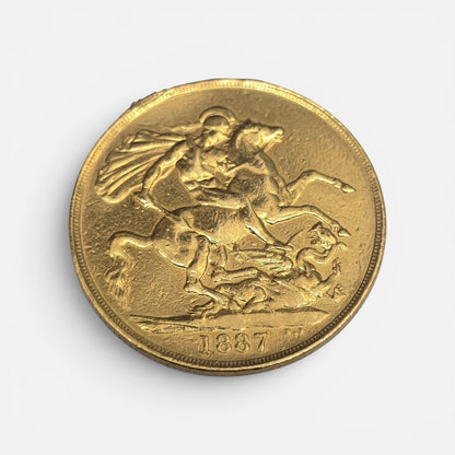 1887 Double Sovereign coin by Reeves and Sons, showing detailed side with intricate design and historical gold coin appearance.